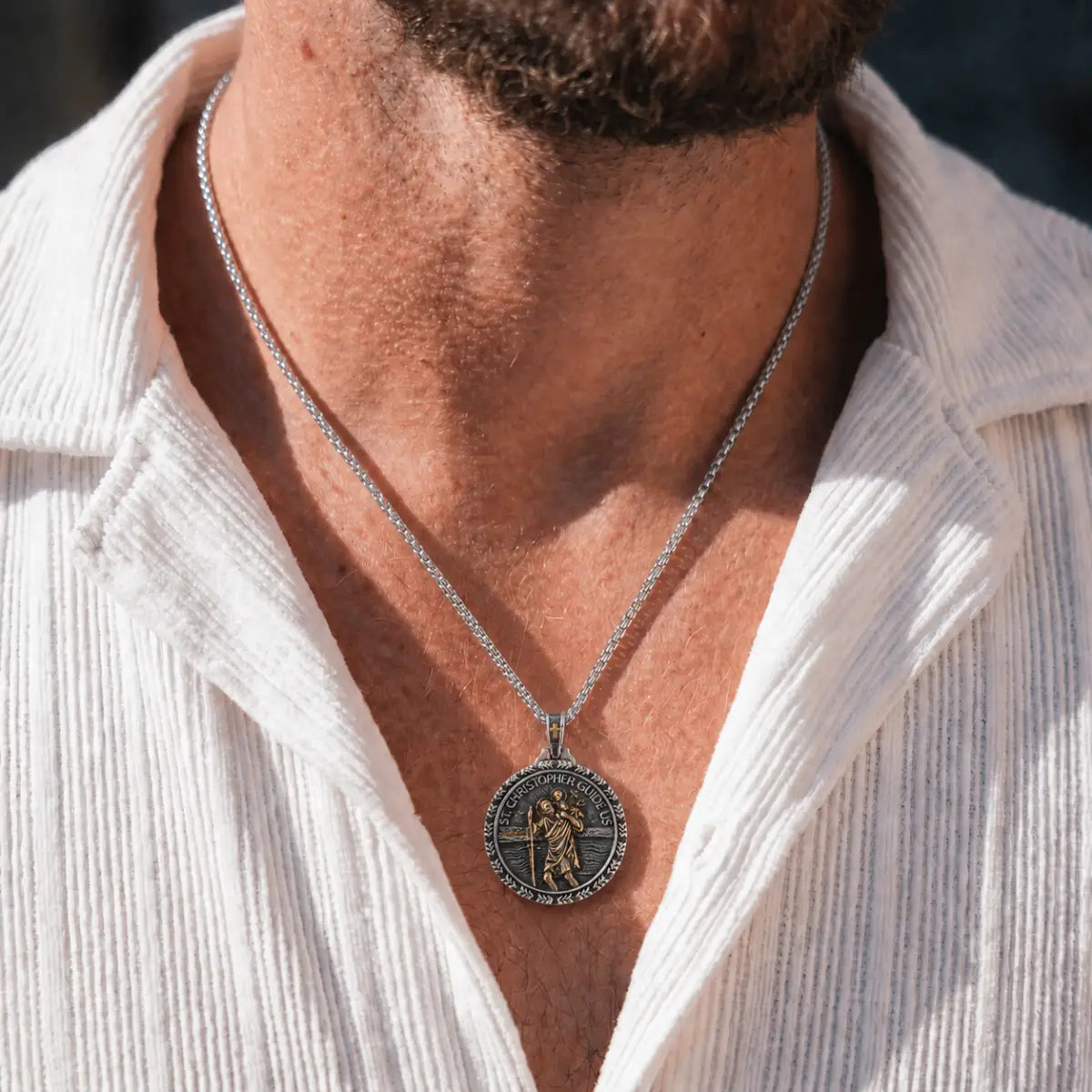 St Christopher Wave Pendant Necklace Gold and Silver Worn by Male Model