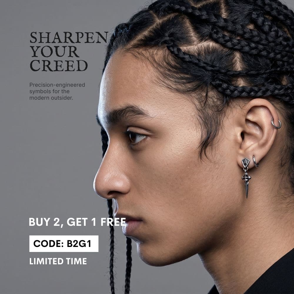 Stainless Steel Sword Earring | Dark Luxury Jewelry. Close-up profile of a model wearing a premium dagger-shaped drop earring.