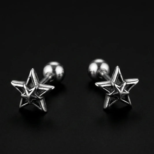 Star Cartilage Stud Earrings Silver Close Up Black Background