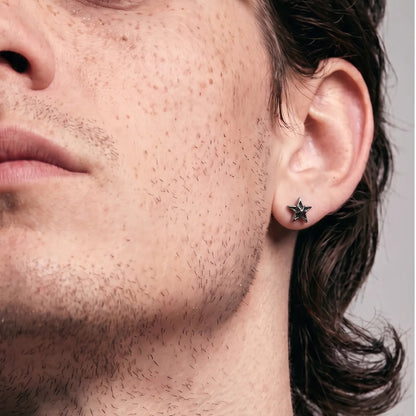 Star Cartilage Stud Earrings Silver Worn by Male Model Look Up