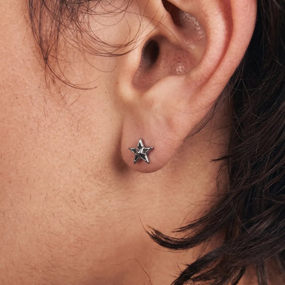 Star Cartilage Stud Earrings Silver Worn by Male Model Side View