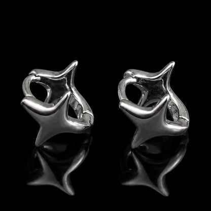 Star Huggie Earrings Silver Close Up Black Background
