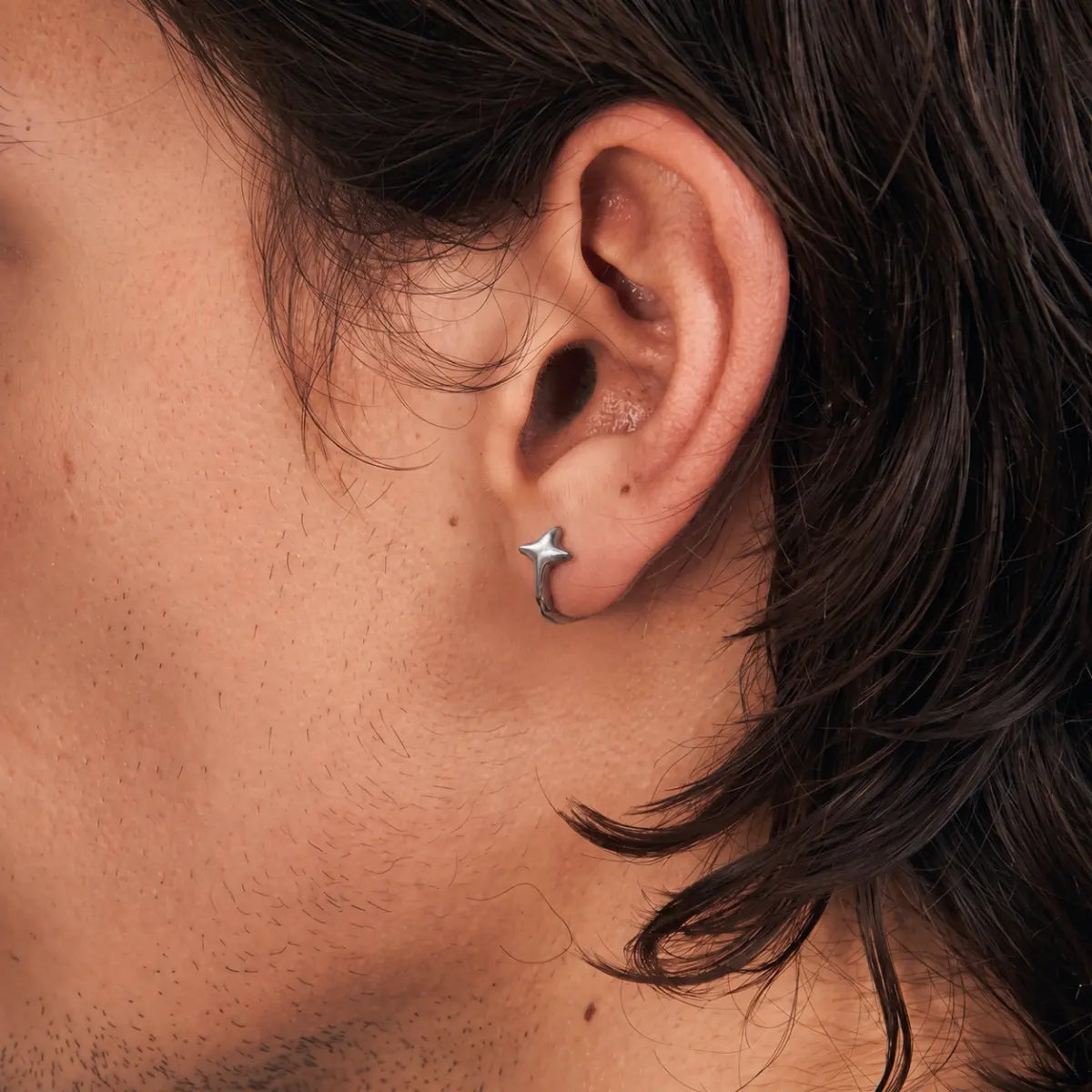 Star Huggie Earrings Silver Side Profile Worn by Male Model