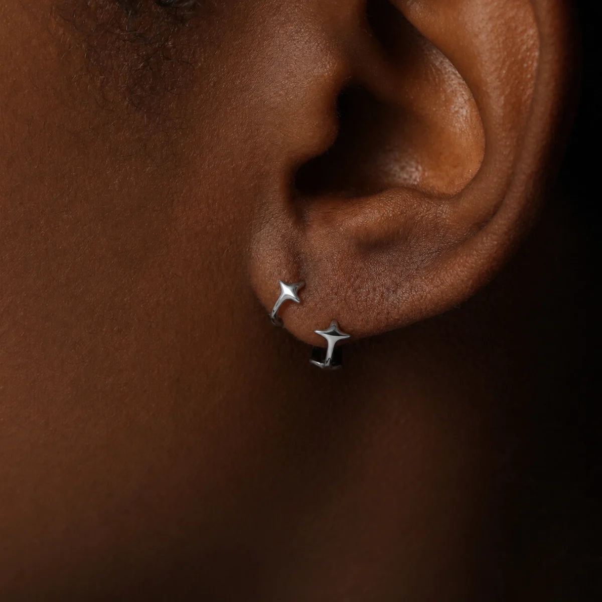 Star Huggie Earrings Silver Worn by Male Model Close Up