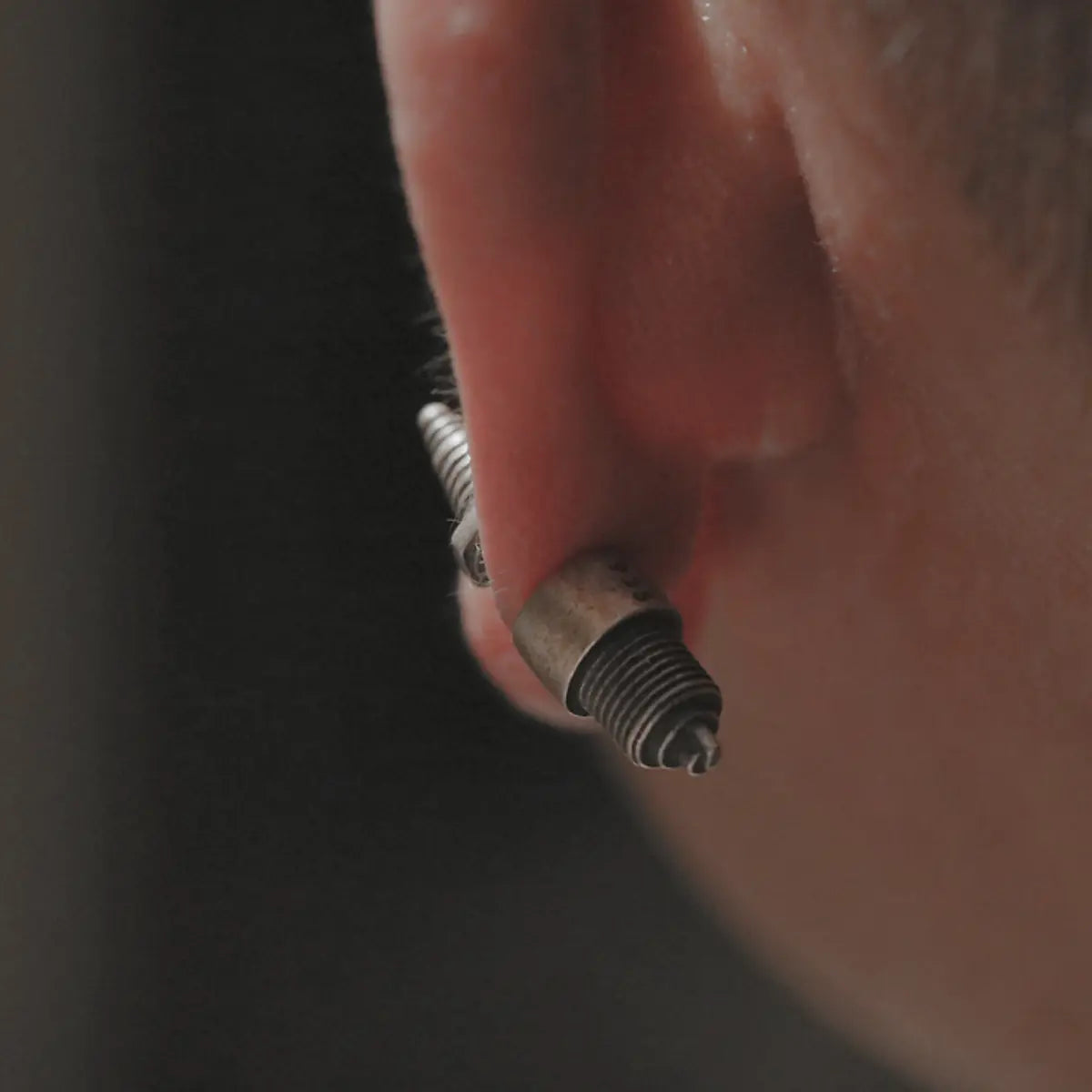 Steampunk Spark Plug Stud Earrings Worn by Male Model Back View