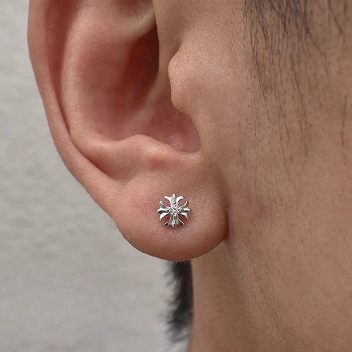 Sterling Silver Petal Cross Stud Earrings Worn by Male Model Front