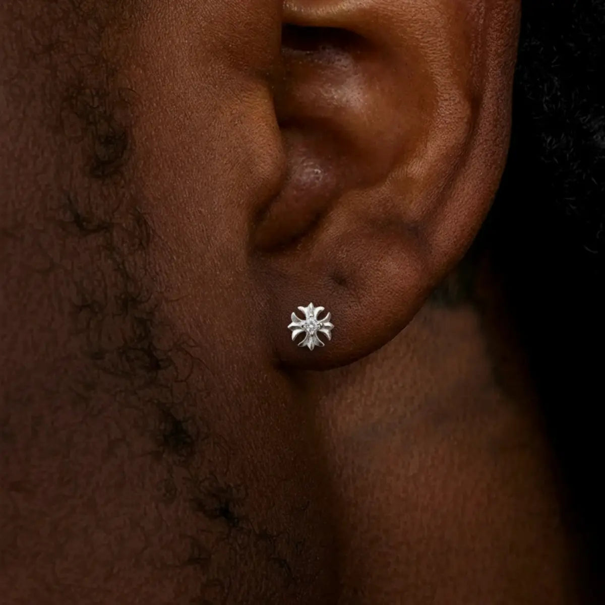 Sterling Silver Petal Cross Stud Earrings Worn by Male Model Side