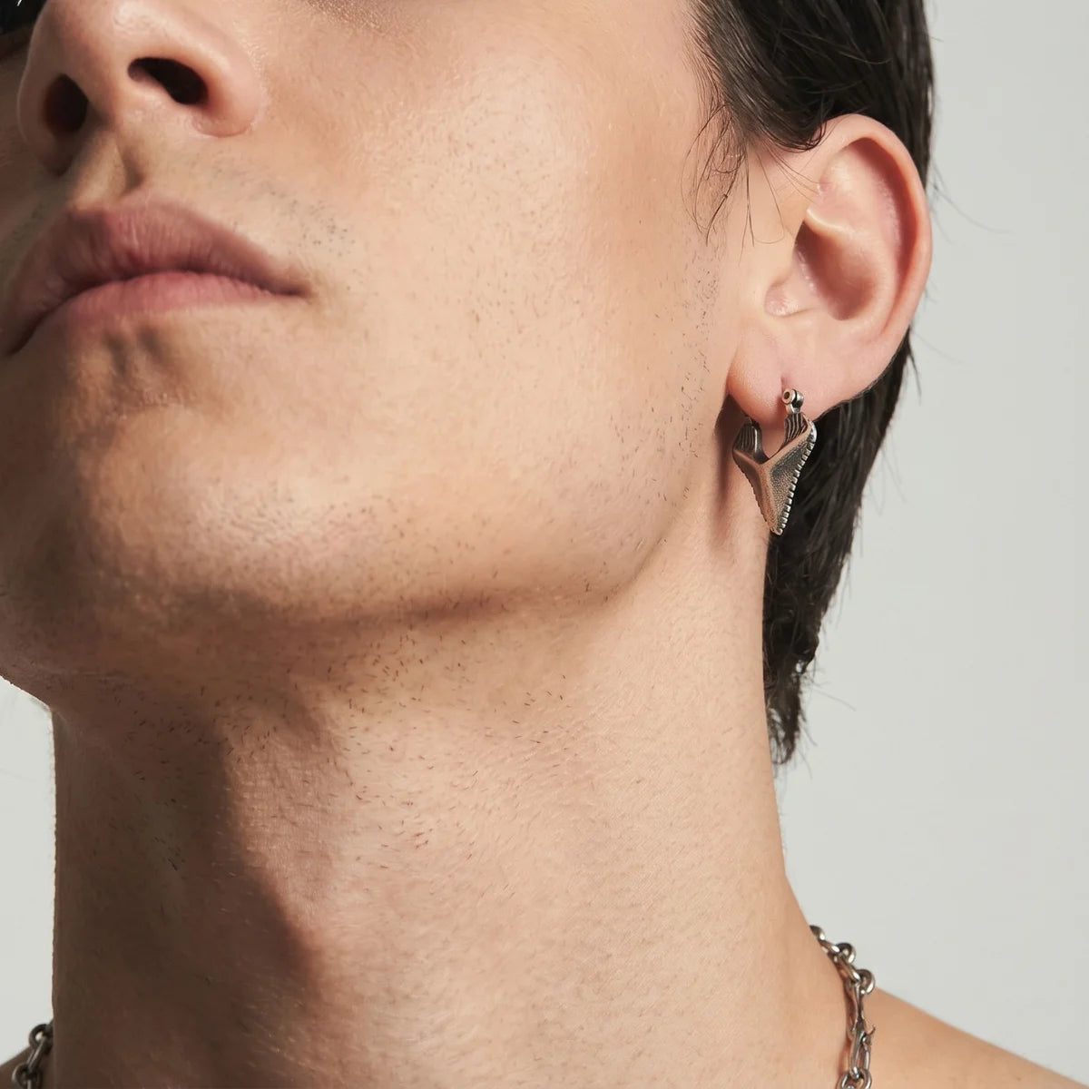 Sterling Silver Shark Tooth Earrings Worn by Male Model Close Up