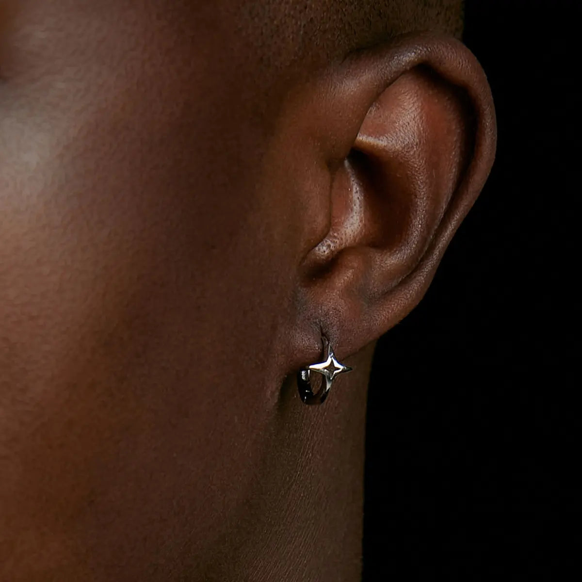 Sterling Silver Star Hoop Earrings Silver Worn by Male Model Front View