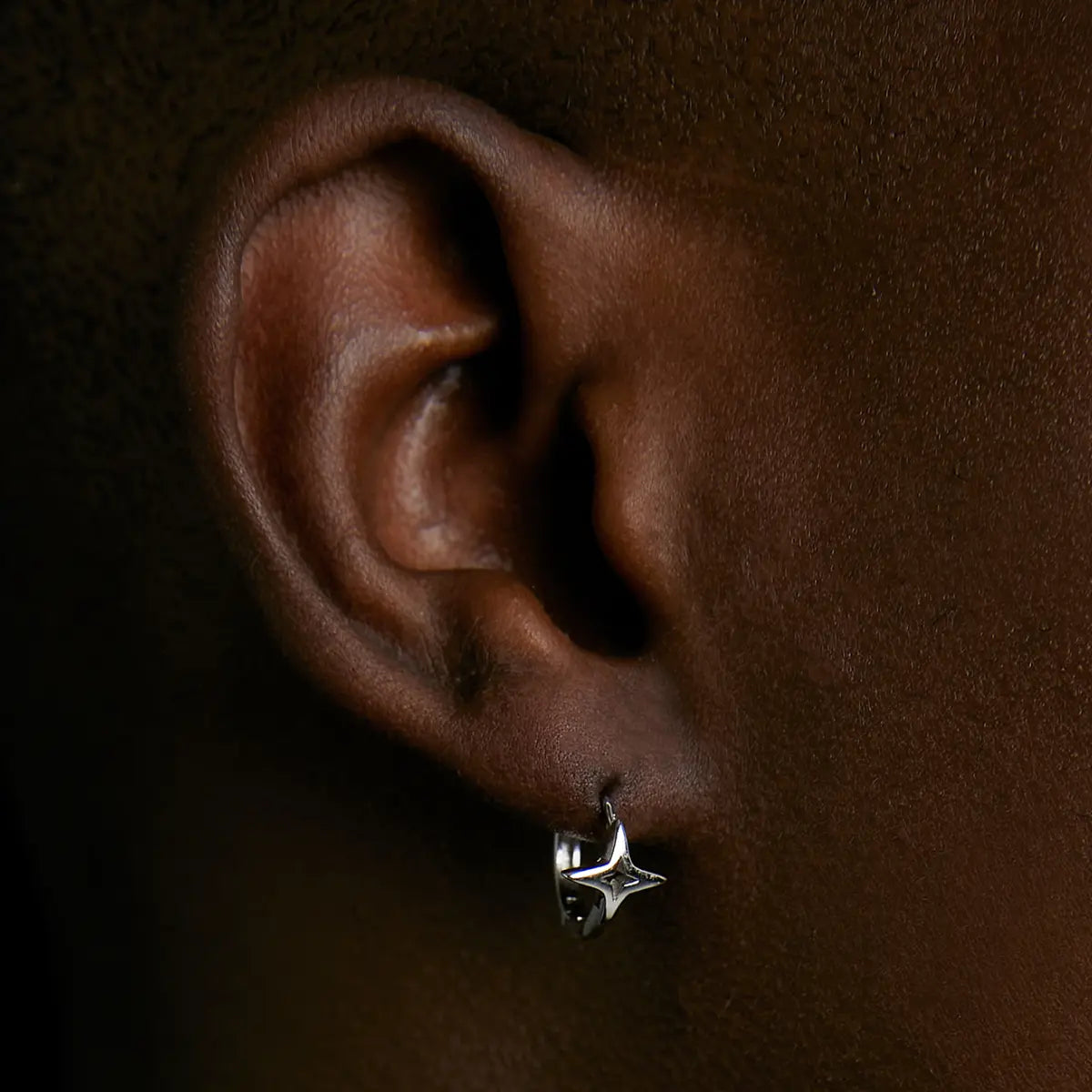 Sterling Silver Star Hoop Earrings Silver Worn by Male Model Side View