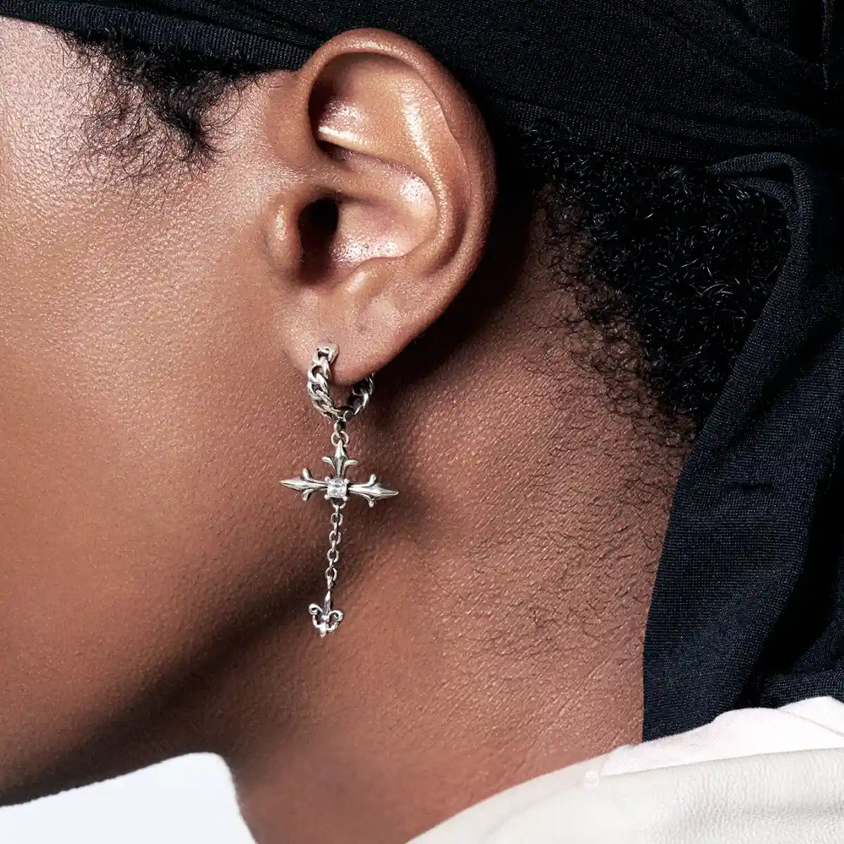 Sterling Silver Twisted Hoop Cross Dangle Earrings Worn by Male Model Close Up