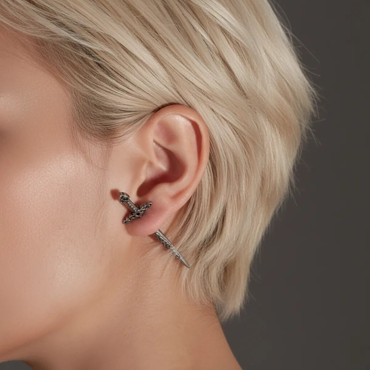 Sword Earrings Through Ear Worn by Female Model