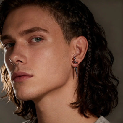 Sword Earrings Through Ear Worn by Male Model