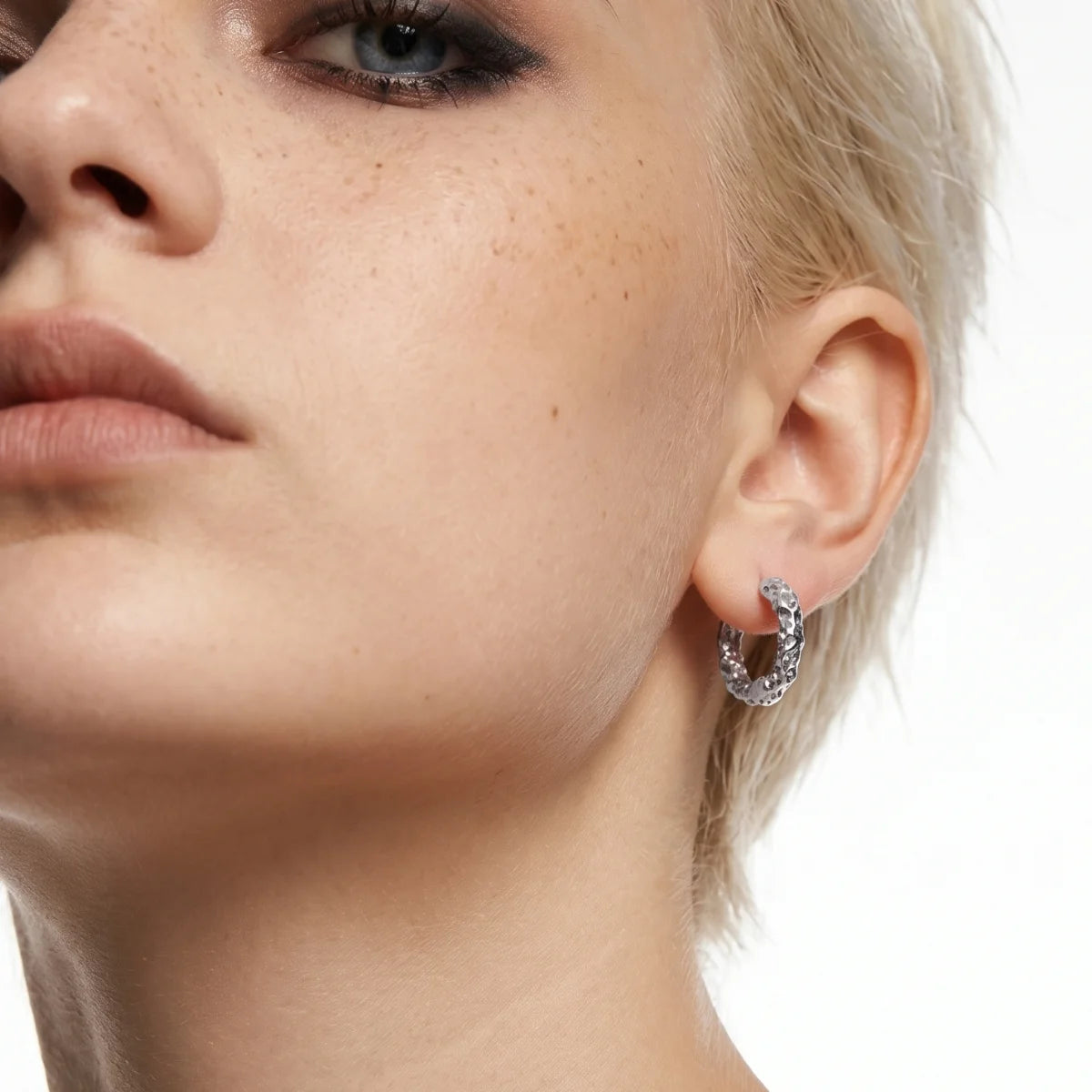Textured Huggie Hoop Earrings White Gold Worn by Female Model
