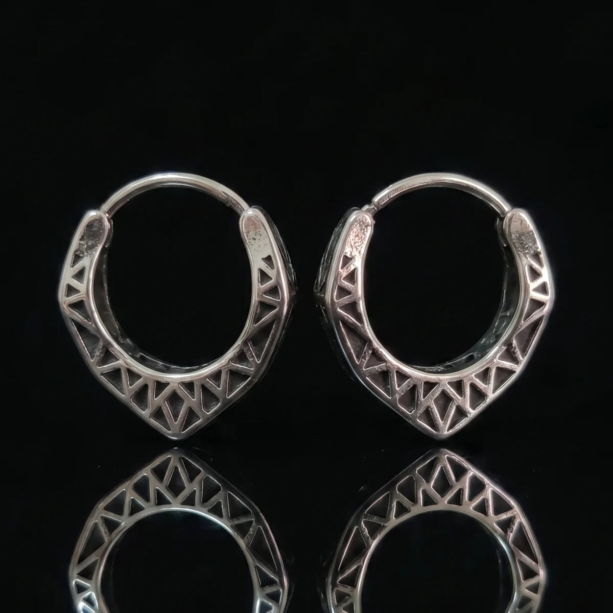 Textured Triangle Hoop Earrings Close Up Black Background with Reflection