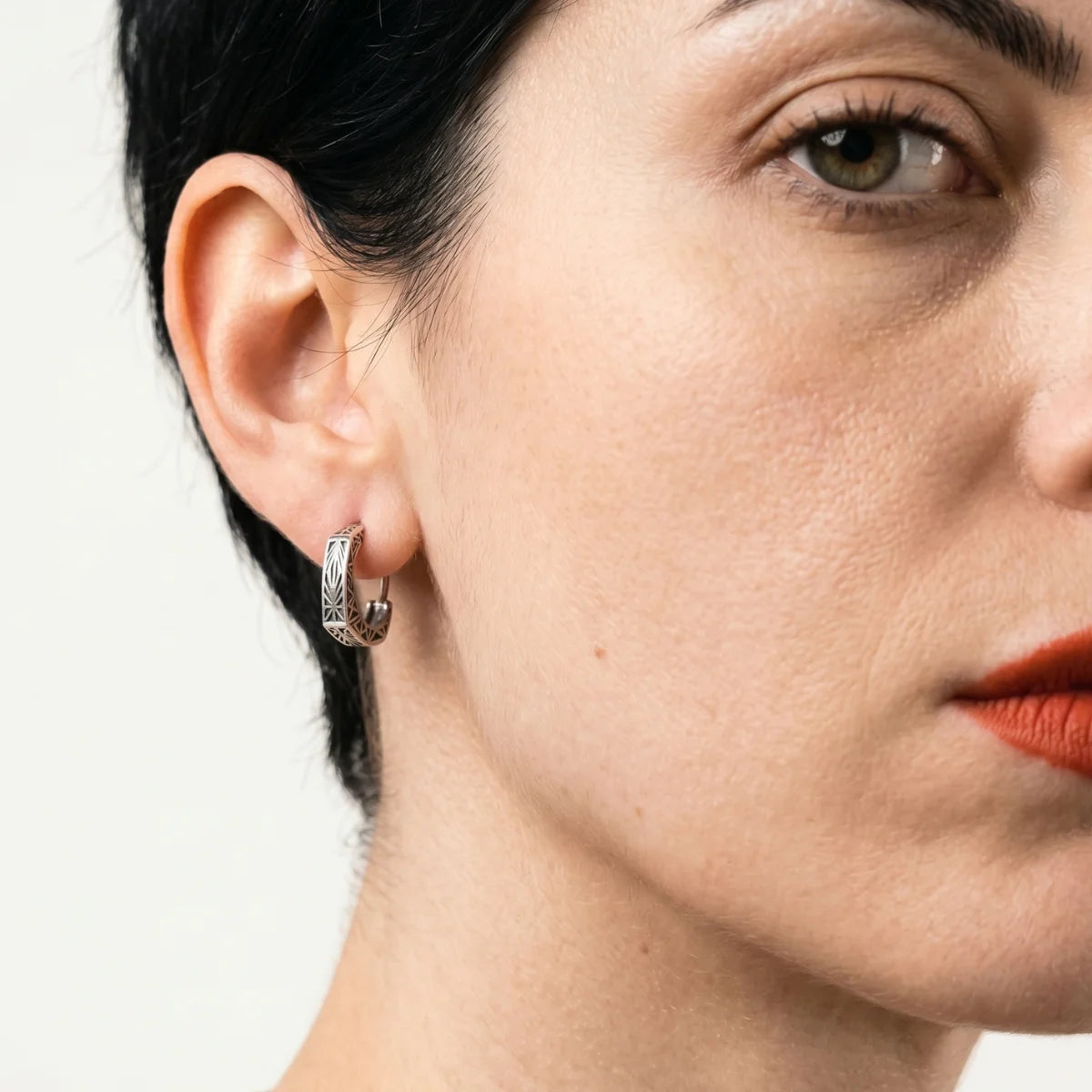 Textured Triangle Hoop Earrings Worn by Female Model Side View