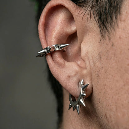 Two Large Spike Hoop Earrings Silver Worn by Male Model Close Up
