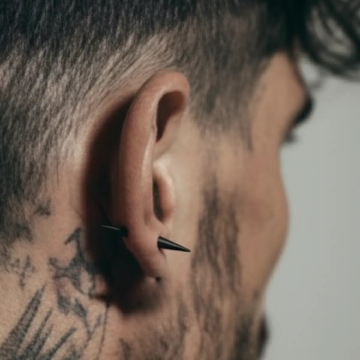 Two Sided Spike Stud Earrings Black Worn by Male Model
