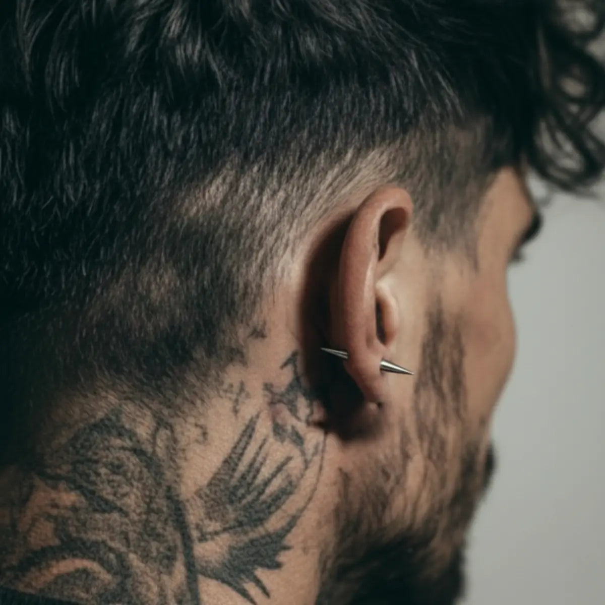 Two Sided Spike Stud Earrings Silver Worn by Male Model