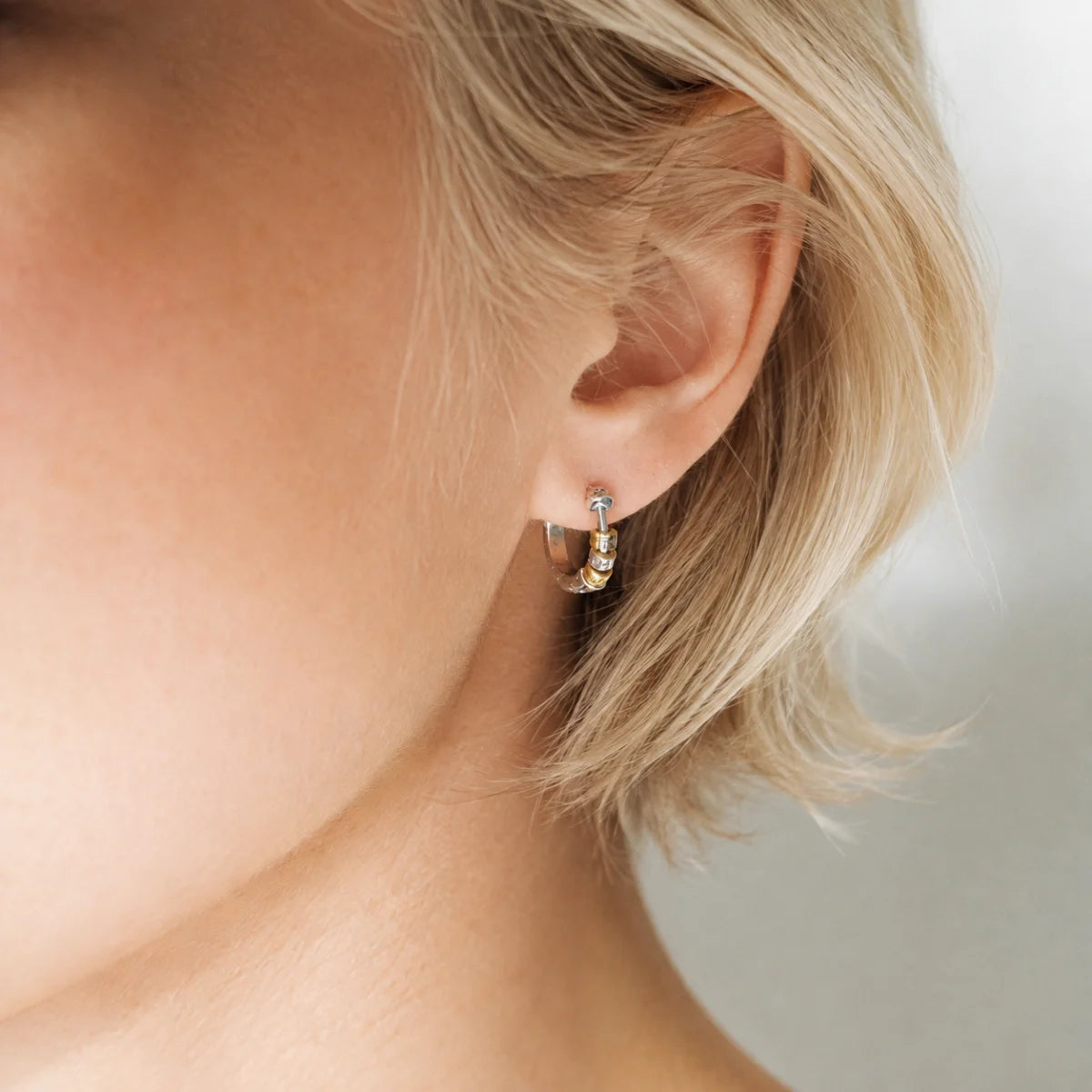 Two-Tone Bead Hoop Earrings Silver Gold Worn on Ear Earring View