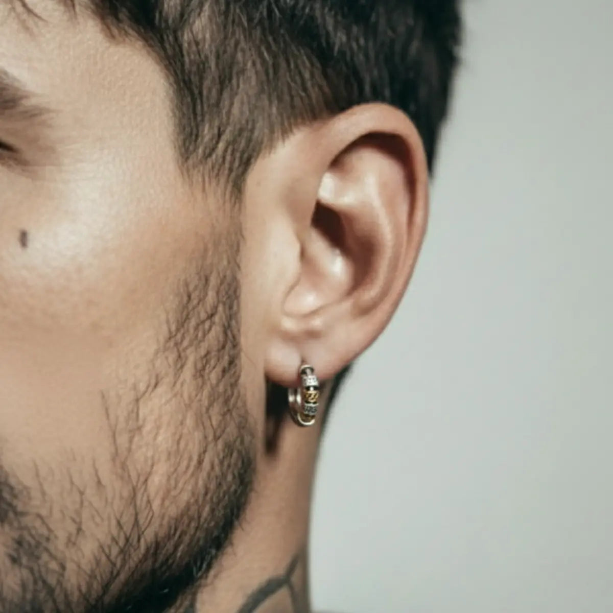 Two Tone Bead Hoop Earrings Worn by Male Model