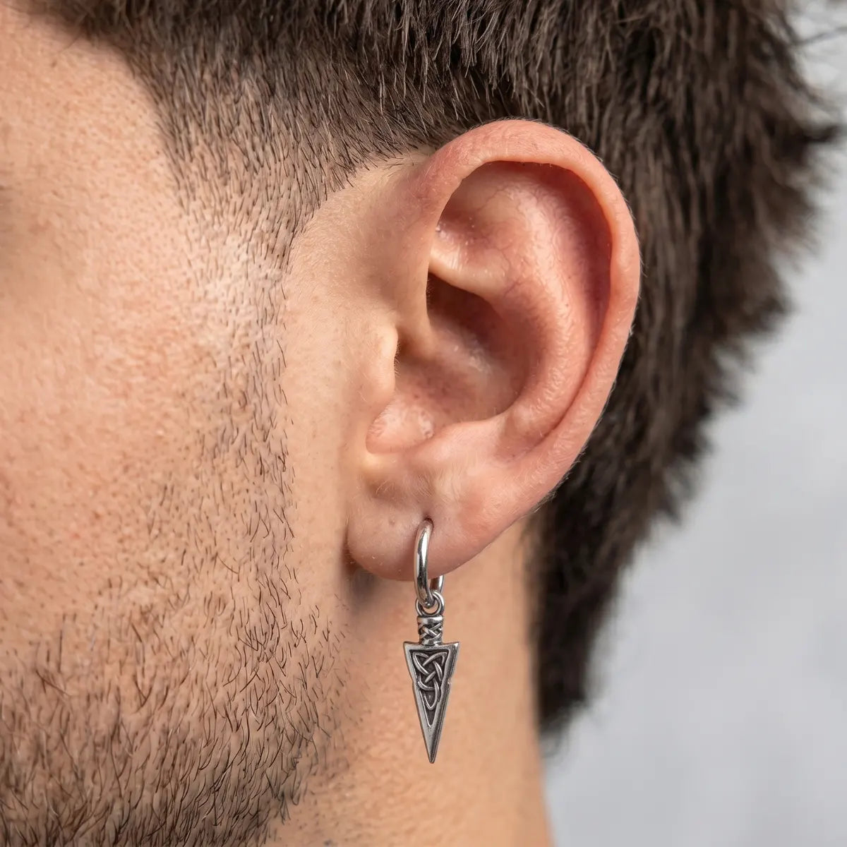 Viking Spear Earrings Silver Worn by Male Model Side View