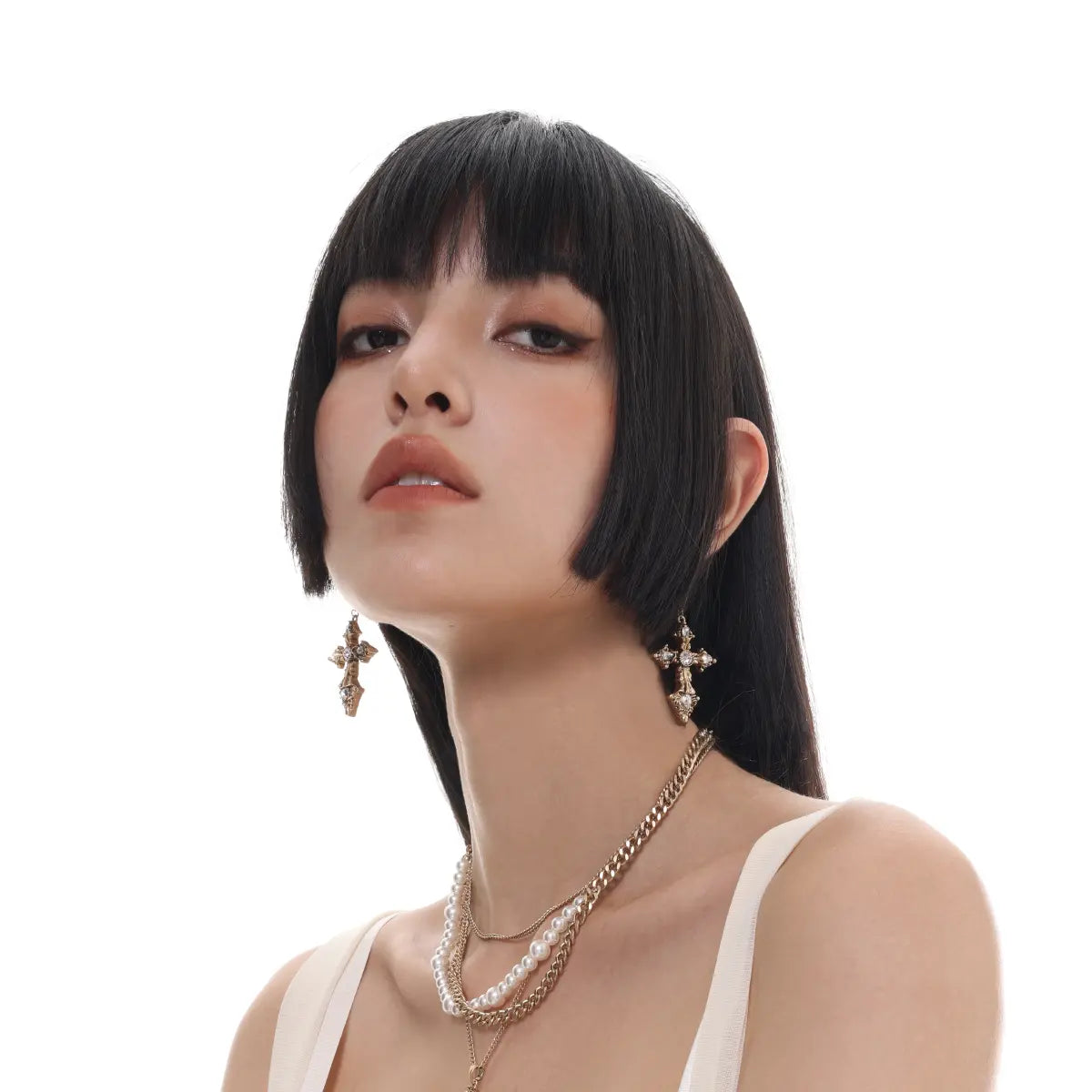 Vintage Ornate Cross Earrings Women Worn by Female Model Front