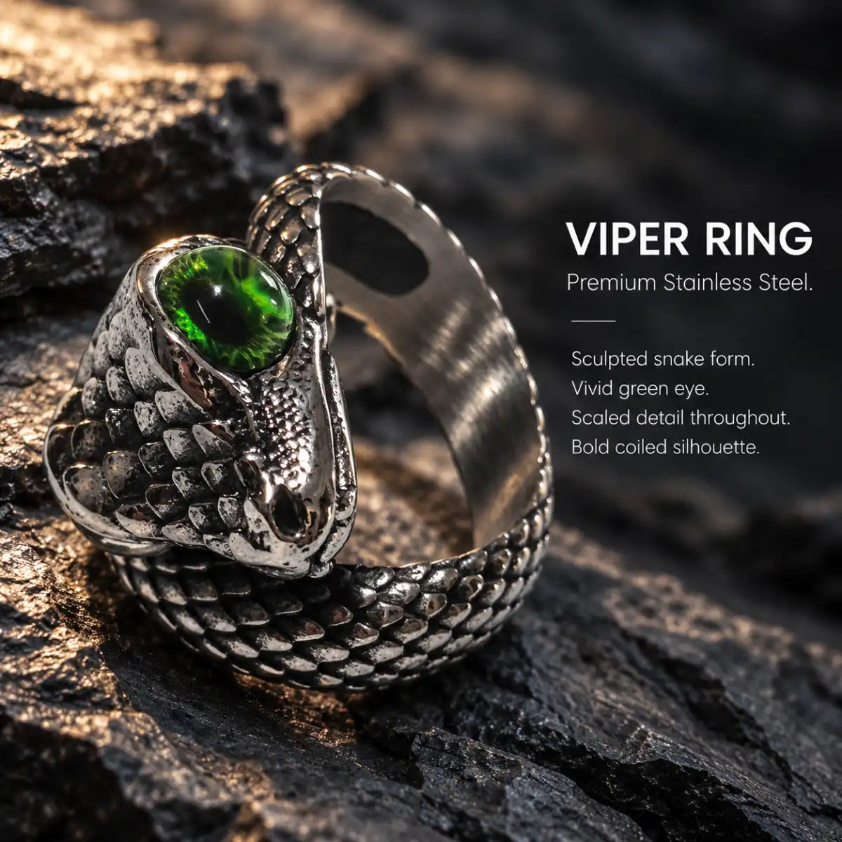 Viper Ring Silver Green Eye Displayed on Stone Surface