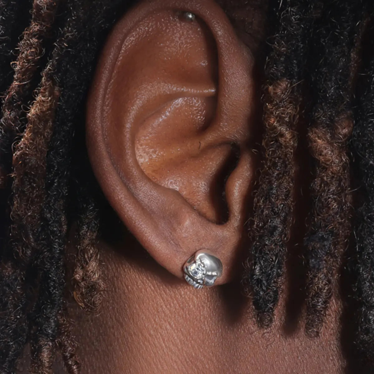 White Eye Skull Stud Earrings Worn by Male Model