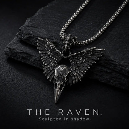 Winged Raven Skull Necklace Antique Silver Displayed on Stone Surface