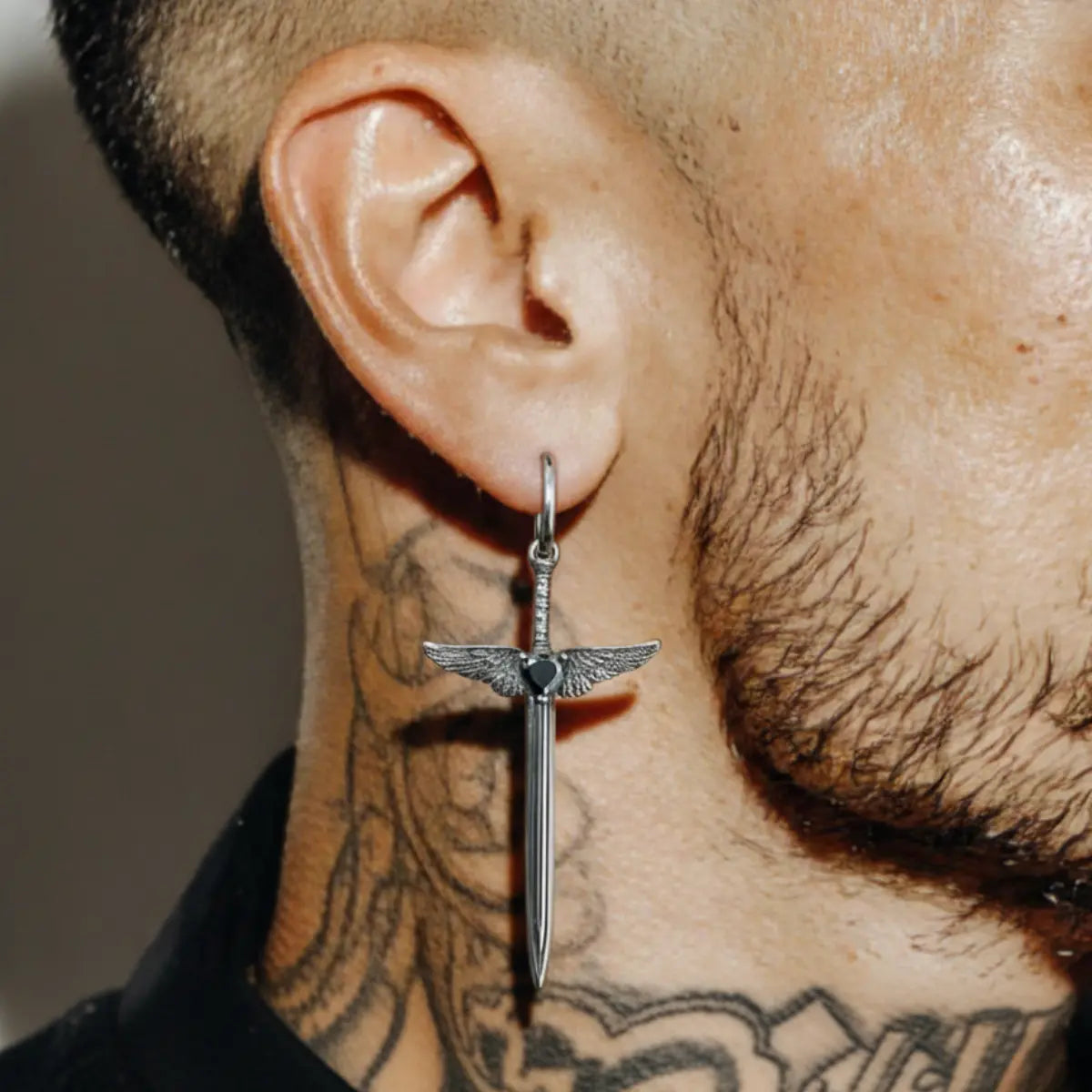 Winged Sword Dangle Earrings Black Worn by Male Model