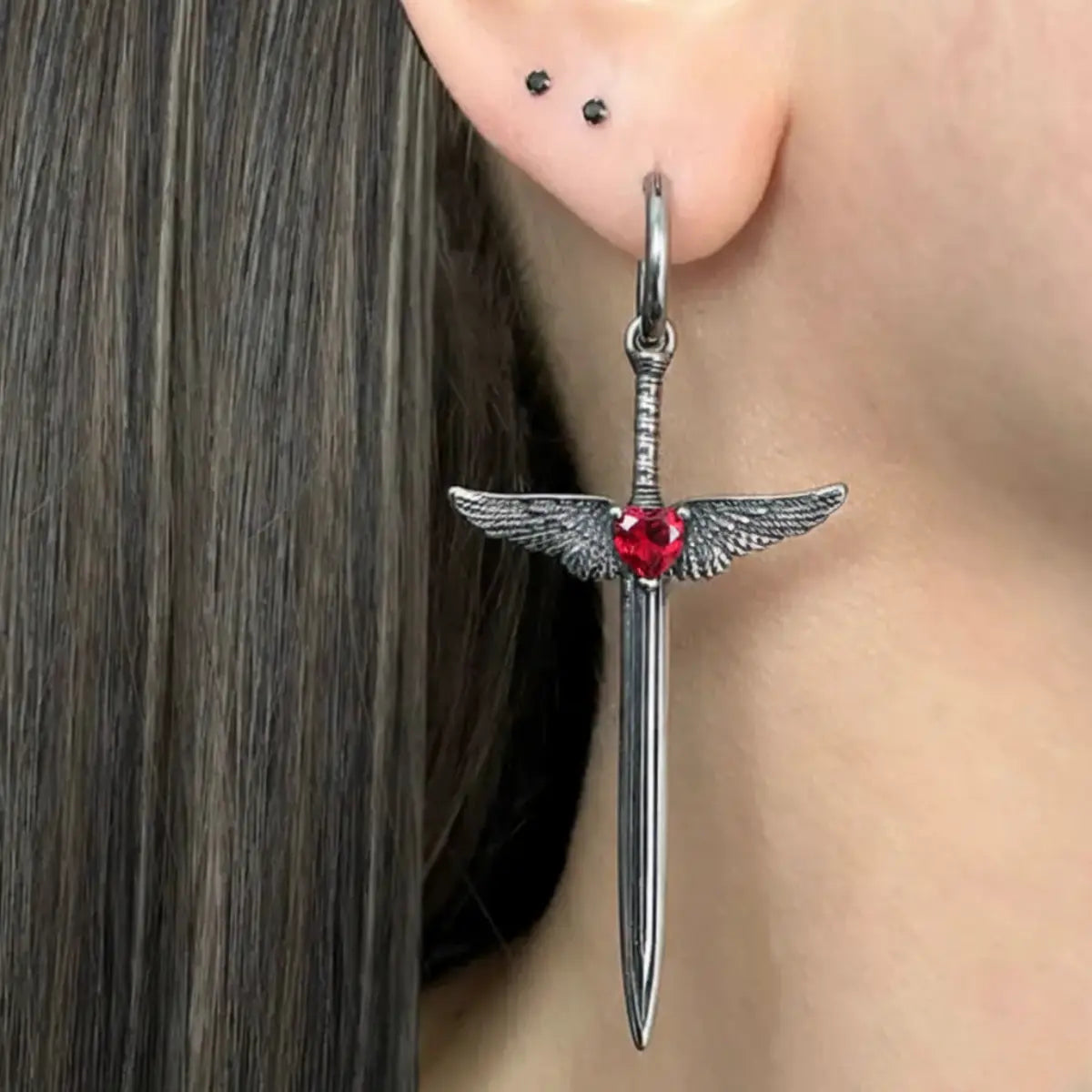 Winged Sword Dangle Earrings Red Worn by Female Model