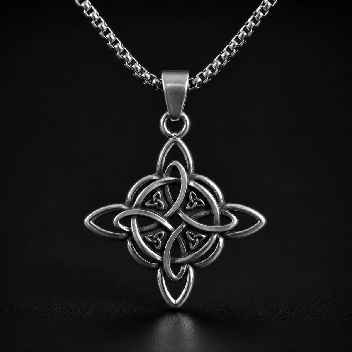 Witches Knot Necklace Silver Close Up Black Background