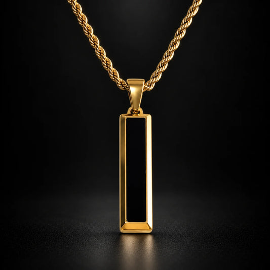black and gold bar necklace black background hero