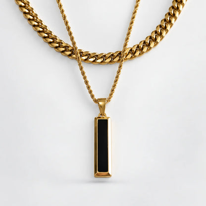 black and gold bar necklace layered set white background