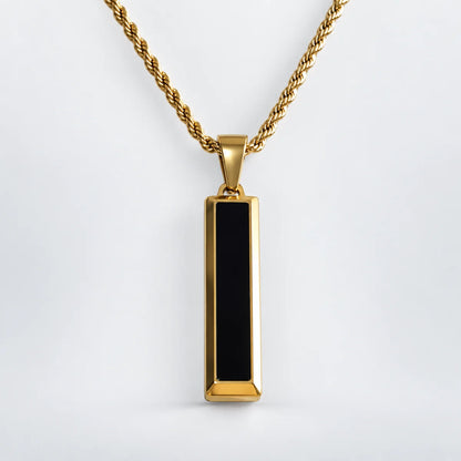 black and gold bar necklace with rope chain white background