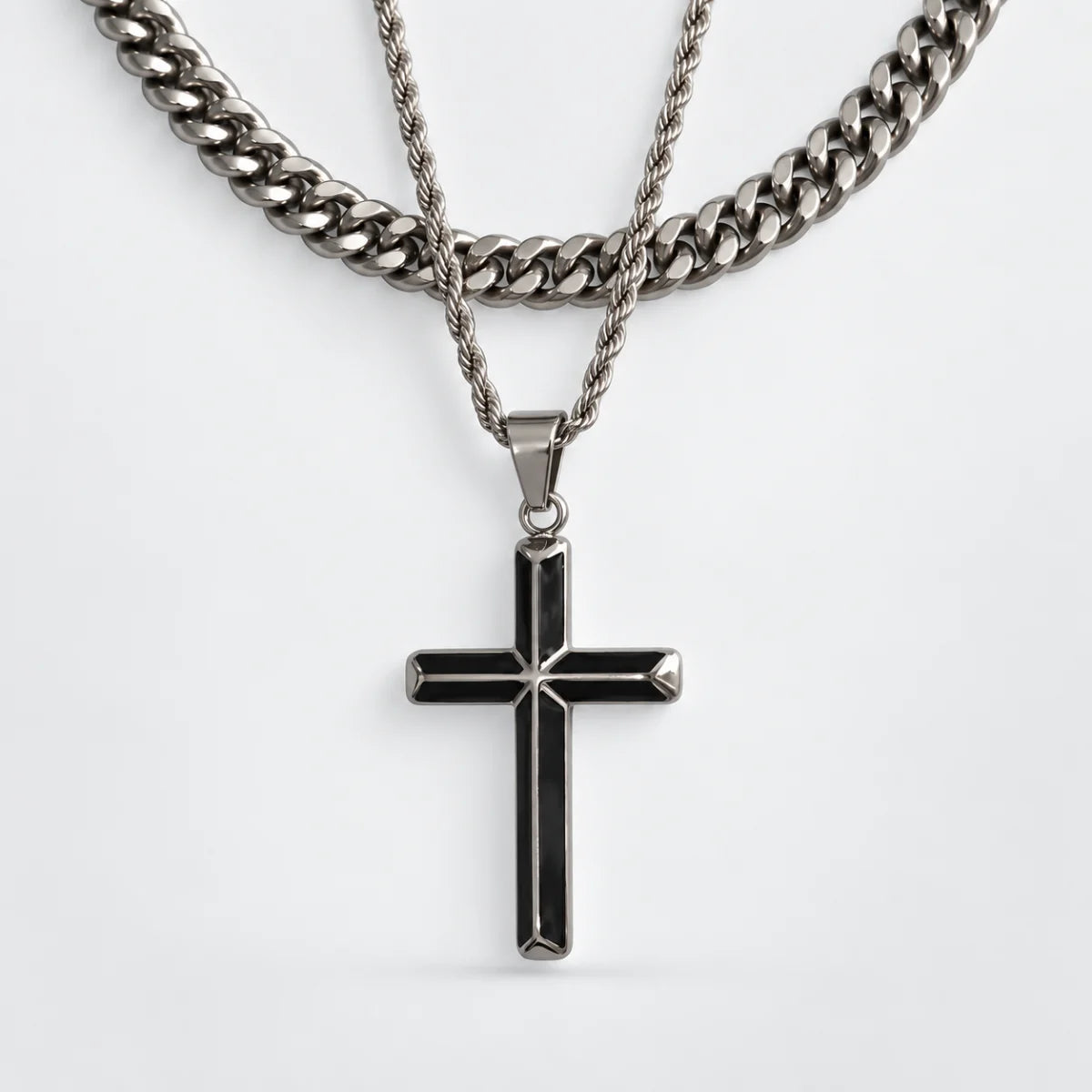 black enamel cross necklace layered set white background