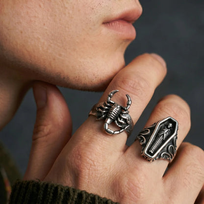 Close Up Hand Wearing 3D Scorpion Ring and Coffin Ring