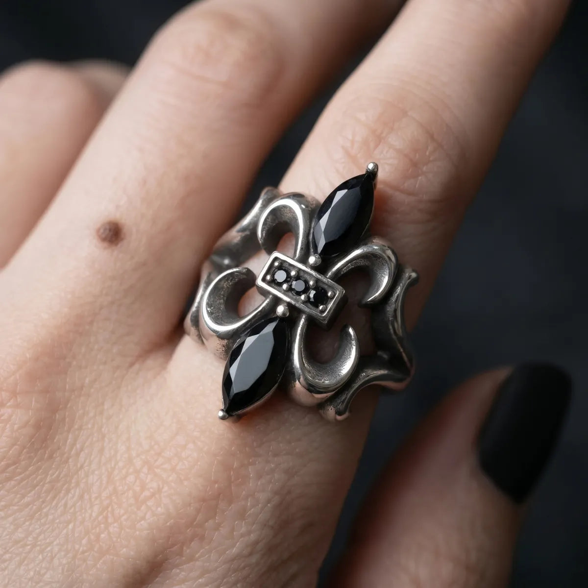 Close Up Hand Wearing Black Stone Fleur De Lis Ring Whimsigoth Aesthetic Accessories