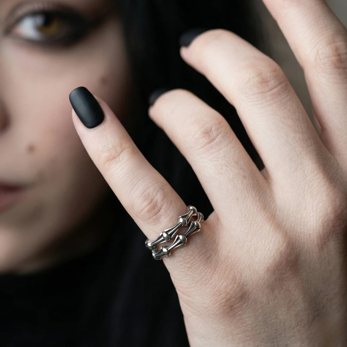 Close Up Hand Wearing Bone Link Ring Stack Dark Aesthetic Womens Jewelry