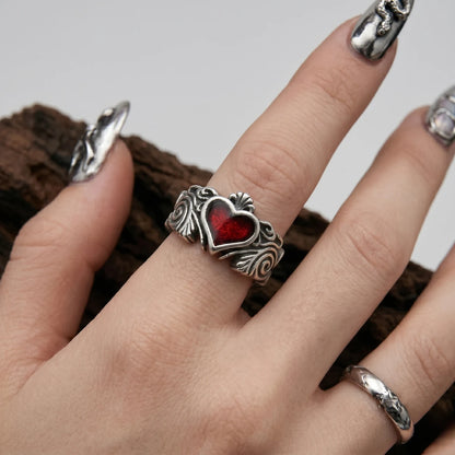 Close Up Hand Wearing Gothic Heart Ring Baroque Scrollwork Witchy Jewelry