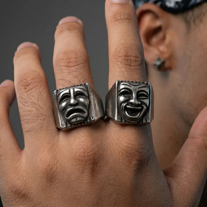 Close Up Hand Wearing Laugh Now Cry Later Rings Chicano Style Mens Jewelry