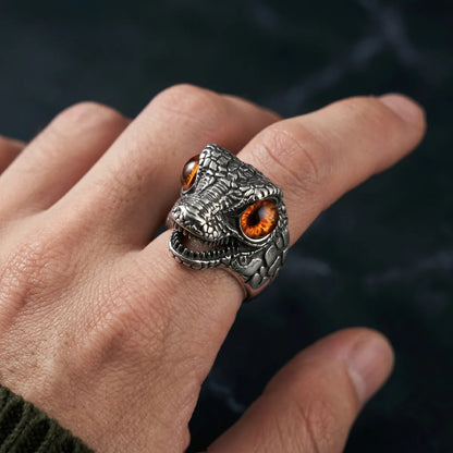 Close Up Hand Wearing T-Rex Eye Ring Brown Eye Gothic Monster Jewelry