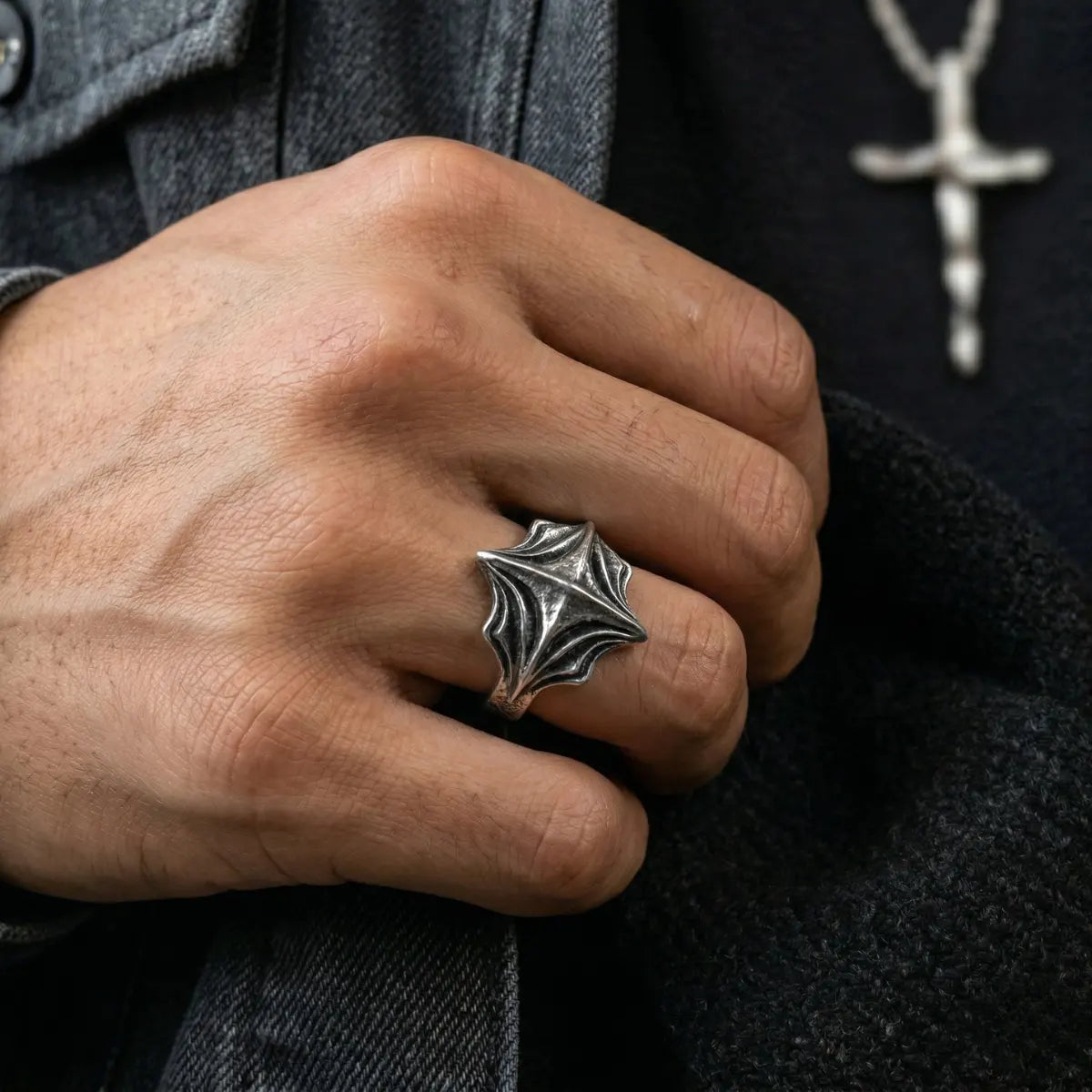 Close up of man wearing silver Four Point Cross Ring