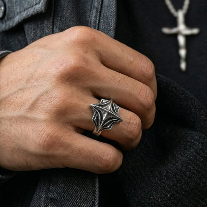 Close up of man wearing silver Four Point Cross Ring