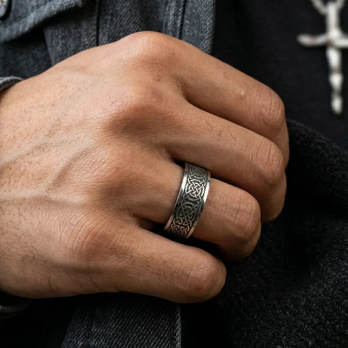 Close up of men’s silver Celtic Knot Band on hand