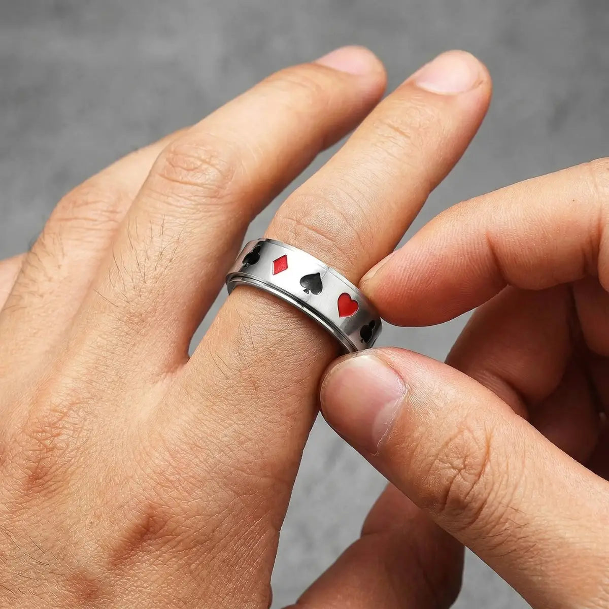 Close up spinning silver Playing Card Spinner Ring
