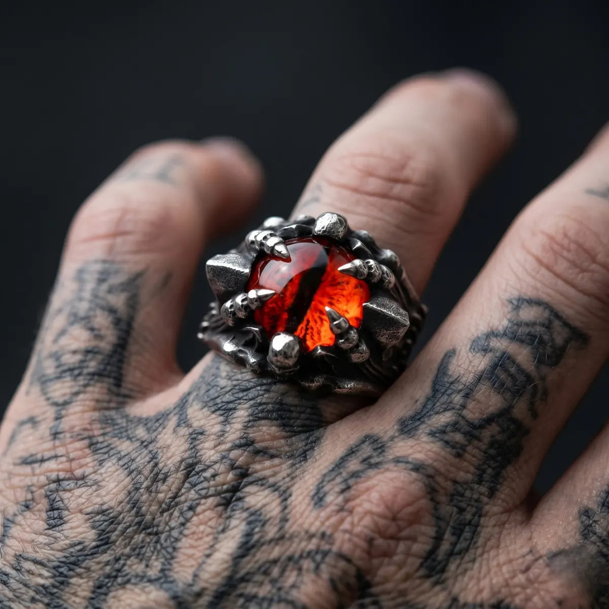 Close Up Tattooed Hand Wearing Dragon Eye Ring Red Eye Mens Fantasy Jewelry