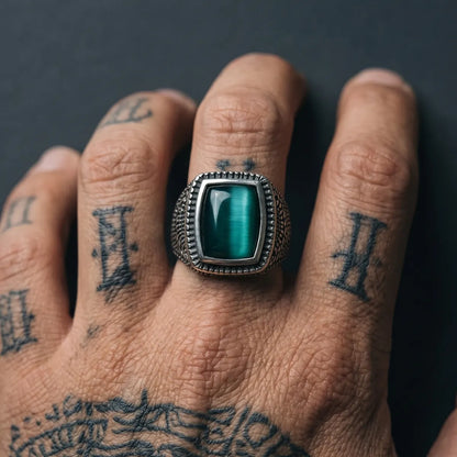 Close Up Tattooed Hand Wearing Rectangular Cat Eye Signet Ring Dark Aesthetic Mens Jewelry