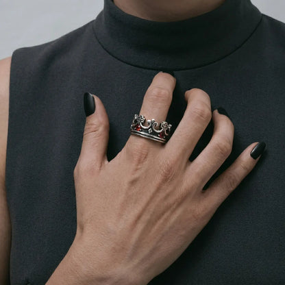 Close up of woman wearing silver Red Stone Crown Ring